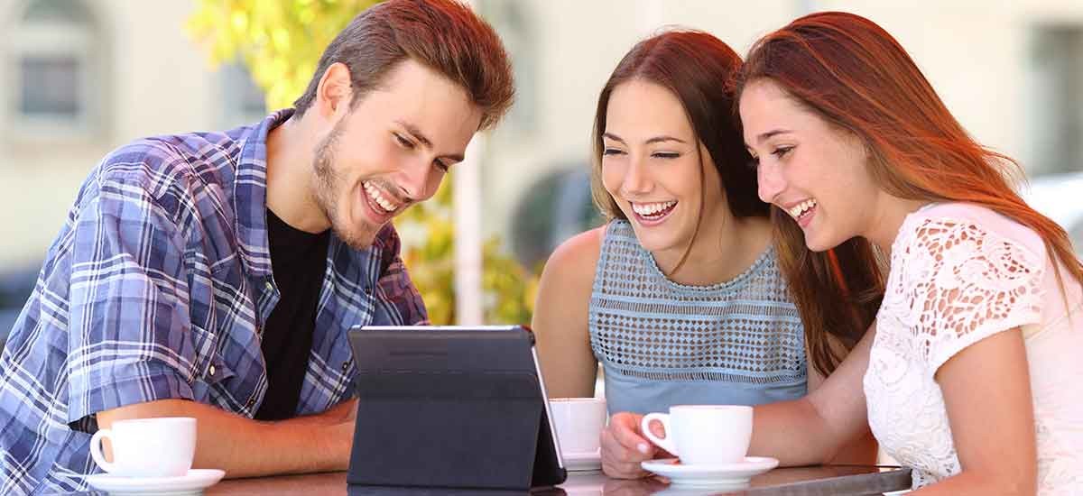 Image of friends laughing while seeing something
